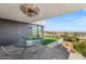 A covered patio features an outdoor dining area with city views at 1491 Reims Dr, Henderson, NV 89012