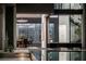 Modern home with pool reflecting the dining room and staircase at 1491 Reims Dr, Henderson, NV 89012