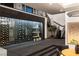 Spacious wine cellar with glass enclosure adjacent to the open staircase at 1491 Reims Dr, Henderson, NV 89012