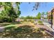 The home's large backyard features mature landscaping, a pool, and plenty of open space at 1798 Lakewood Dr, Henderson, NV 89012
