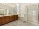 Bright bathroom with double vanity, soaking tub, and glass-enclosed shower at 1798 Lakewood Dr, Henderson, NV 89012