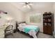 Cozy bedroom featuring a bed, desk, and bookcase; window provides natural light at 1798 Lakewood Dr, Henderson, NV 89012