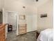 This bedroom features tile floors, a closet with sliding doors, and an adjacent room at 1798 Lakewood Dr, Henderson, NV 89012