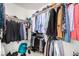 Walk-in closet with ample storage space, filled with a variety of clothing at 1798 Lakewood Dr, Henderson, NV 89012