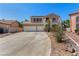 Charming two-story home with a three car garage and low maintenance desert landscaping at 1798 Lakewood Dr, Henderson, NV 89012