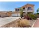 Attractive two-story home with a two-car garage, well-maintained landscaping, and a balcony at 1798 Lakewood Dr, Henderson, NV 89012