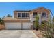 Charming two-story home with a three car garage, front balcony, and low maintenance desert landscaping at 1798 Lakewood Dr, Henderson, NV 89012