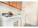 The laundry room features a side-by-side washer and dryer, plus overhead cabinets at 1798 Lakewood Dr, Henderson, NV 89012