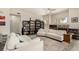 Inviting living room features a cozy fireplace and custom built-in bookshelves at 1798 Lakewood Dr, Henderson, NV 89012
