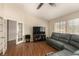 Second living room with hardwood floors and a comfortable gray sofa at 1798 Lakewood Dr, Henderson, NV 89012