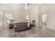 Relaxing main bedroom with neutral tones, tile flooring, and ensuite bathroom at 1798 Lakewood Dr, Henderson, NV 89012