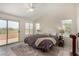 Serene main bedroom offers natural light and private balcony access at 1798 Lakewood Dr, Henderson, NV 89012