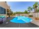 Inviting pool with clear water and a relaxing spa, surrounded by palm trees and a fenced yard at 1798 Lakewood Dr, Henderson, NV 89012