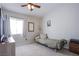 Cozy bedroom featuring a comfortable daybed, window, and neutral carpeting at 1844 Ghost Trace Ave, Las Vegas, NV 89183