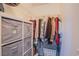 Walk-in closet featuring shelving, storage bins, and ample hanging space for clothing at 1844 Ghost Trace Ave, Las Vegas, NV 89183