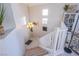 Home entry with carpeted stairs and a contemporary chandelier at 1844 Ghost Trace Ave, Las Vegas, NV 89183