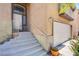 Close-up of home's entrance, showing stairs to the front door and a two-car garage at 1844 Ghost Trace Ave, Las Vegas, NV 89183