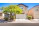 Charming two-story home with a well-manicured front yard and a two-car garage at 1844 Ghost Trace Ave, Las Vegas, NV 89183