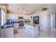 Modern kitchen with white cabinets, granite countertops, and stainless steel appliances at 1844 Ghost Trace Ave, Las Vegas, NV 89183