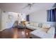 Open-concept living area with hardwood floors, neutral decor, and stairway at 1844 Ghost Trace Ave, Las Vegas, NV 89183