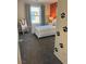 Cozy bedroom with paw print accents, a window with neighborhood view, and a comfortable bed with patterned linens at 1900 Arietta Vista St, Henderson, NV 89044