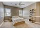 Bedroom featuring a ceiling fan, neutral color scheme, and bright natural light at 2008 Winter Wind St, Las Vegas, NV 89134
