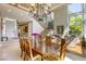 Spacious dining room featuring high ceilings, large windows, and elegant staircase at 2008 Winter Wind St, Las Vegas, NV 89134