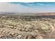 Scenic aerial view showcasing a golf course community with lush greenery and mountain views at 2080 Powder Springs St, Henderson, NV 89052