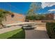 Terraced backyard with artificial turf and landscaping at 2080 Powder Springs St, Henderson, NV 89052