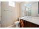 Well-lit bathroom featuring a sleek vanity, toilet, and large mirror reflecting the shower at 2080 Powder Springs St, Henderson, NV 89052
