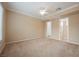 Spacious bedroom with neutral carpet, ceiling fan, and natural light, ready for relaxation at 2080 Powder Springs St, Henderson, NV 89052