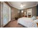 Cozy bedroom with neutral walls, a ceiling fan, and access to an outdoor patio at 2080 Powder Springs St, Henderson, NV 89052