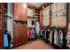 Walk-in closet with custom wood shelving, drawers and multiple hanging rods at 2080 Powder Springs St, Henderson, NV 89052