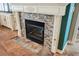 A stylish fireplace with a decorative mantel and stone surround complements the living room's design at 2080 Powder Springs St, Henderson, NV 89052