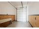 Clean, spacious garage with white door and wood paneling, offering ample parking and storage at 2080 Powder Springs St, Henderson, NV 89052