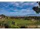 Expansive golf course view overlooking the city skyline, nestled within a serene, natural landscape at 2080 Powder Springs St, Henderson, NV 89052