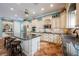 Modern kitchen features an island, stainless steel appliances, and custom cabinetry at 2080 Powder Springs St, Henderson, NV 89052