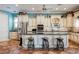 Gourmet kitchen features an island, stainless steel appliances, and custom cabinetry at 2080 Powder Springs St, Henderson, NV 89052