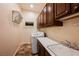 Laundry room with washer, dryer, sink, counter space, and overhead cabinets at 2080 Powder Springs St, Henderson, NV 89052