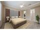 Staged main bedroom with plush bed, designer headboard, and modern lighting creates a cozy retreat at 2080 Powder Springs St, Henderson, NV 89052