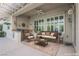 Stylishly staged covered patio with comfortable seating and elegant decor for relaxed outdoor entertaining at 2080 Powder Springs St, Henderson, NV 89052