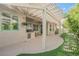 Spacious covered patio with outdoor kitchen and view of the landscaped backyard at 2080 Powder Springs St, Henderson, NV 89052