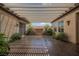 Outdoor patio with tiled floors, ample shade, decorative plants and a fountain at 2080 Powder Springs St, Henderson, NV 89052