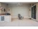 Covered patio with built-in grill, ceiling fan, and sliding door for easy indoor-outdoor living at 2080 Powder Springs St, Henderson, NV 89052
