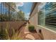 Landscaped side yard with a walkway and views of the house at 2080 Powder Springs St, Henderson, NV 89052