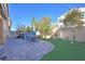 Backyard featuring brick pavers, a patch of grass, a fence, and a hot tub at 2194 Trivero St, Henderson, NV 89044