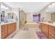 Spacious bathroom with double vanities, large soaking tub, and separate shower at 2194 Trivero St, Henderson, NV 89044