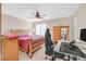 Bedroom featuring neutral walls, ceiling fan, and a wooden bed frame at 2194 Trivero St, Henderson, NV 89044