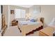 Bedroom with neutral walls, carpet, floral decor, and a neatly made bed at 2194 Trivero St, Henderson, NV 89044