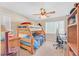 Bedroom with ceiling fan, window with blinds, a bunk bed, desk and chair at 2194 Trivero St, Henderson, NV 89044